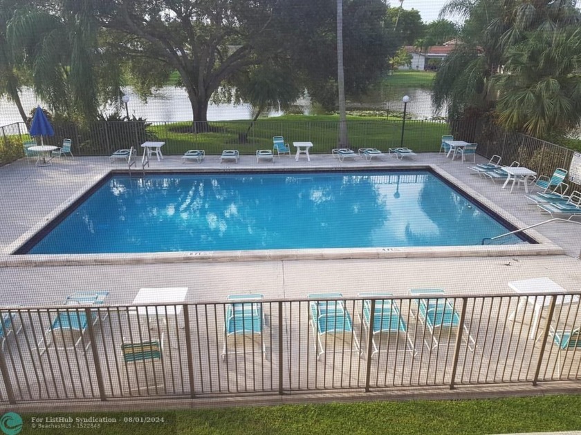 GORGEOUS VIEW OF LAKE, POOL, AND GREEN SORROUNDS THIS CONDO - Beach Condo for sale in Coral Springs, Florida on Beachhouse.com