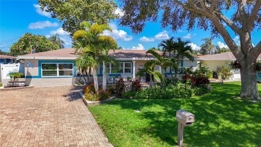 **Stunning Waterfront Home in Kenneth City** Discover your dream - Beach Home for sale in Kenneth City, Florida on Beachhouse.com