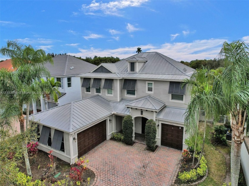 Discover lakeside living. This home has a 3-car garage, 5 - Beach Home for sale in West Palm Beach, Florida on Beachhouse.com
