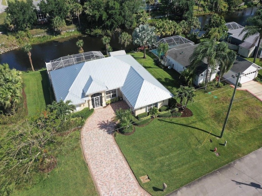 Exquisite pool home on canal offers paver driveway & etched - Beach Home for sale in Sebastian, Florida on Beachhouse.com