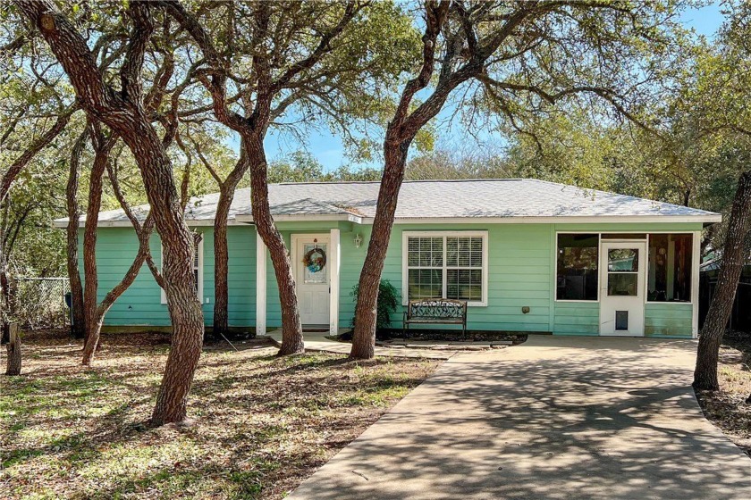 Nestled beneath large shade oak trees, this fully furnished - Beach Home for sale in Rockport, Texas on Beachhouse.com