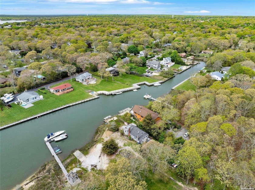 Welcome to your waterfront oasis in Hampton Bays! This charming - Beach Home for sale in Hampton Bays, New York on Beachhouse.com