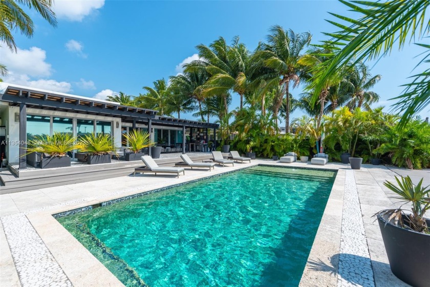 This exclusive and peaceful waterfront 4-bed/4.5-bath oasis is - Beach Home for sale in Miami Beach, Florida on Beachhouse.com