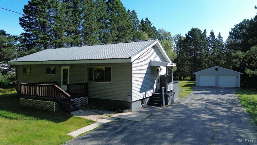 Sitting on a quiet residential street in Hiawatha Township - Beach Home for sale in Manistique, Michigan on Beachhouse.com