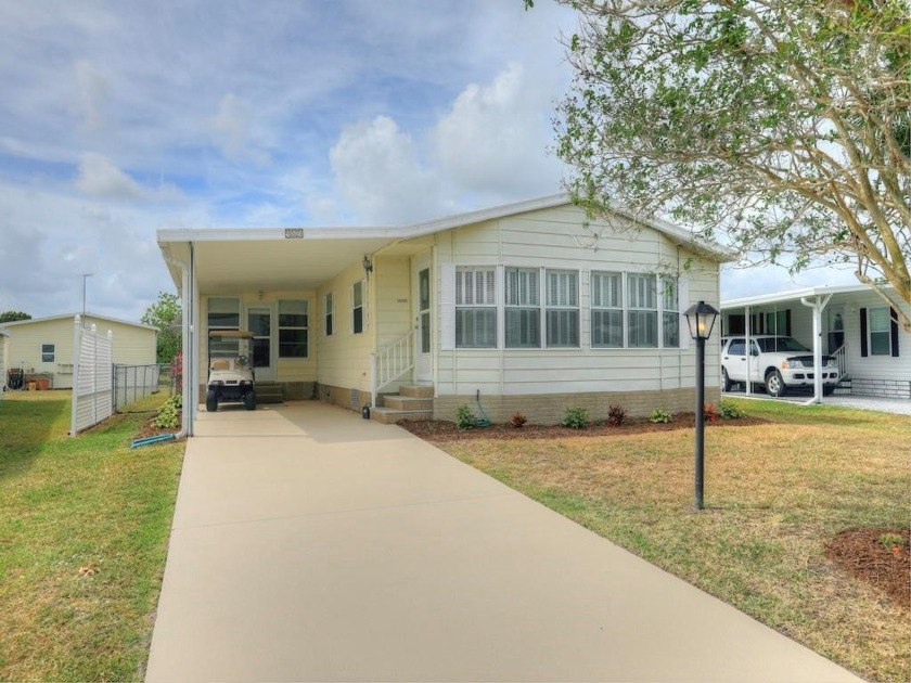 Over 1300 sq ft inside plus raised enclosed porch. Short stroll - Beach Home for sale in Barefoot Bay, Florida on Beachhouse.com