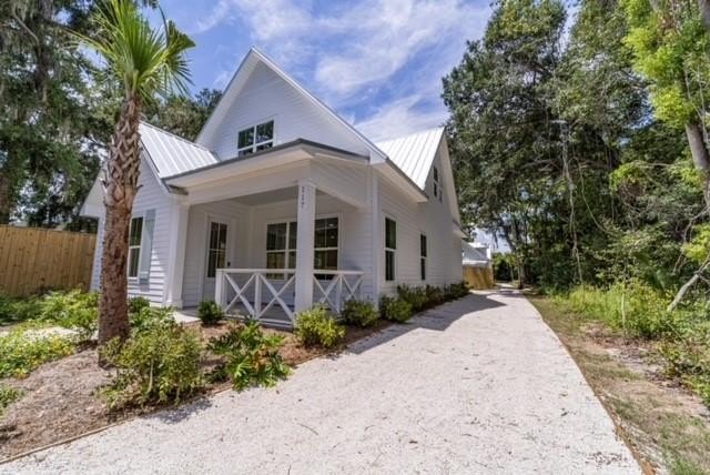 Tucked on a quiet street right in the heart of St. Simons, this - Beach Home for sale in Saint Simons, Georgia on Beachhouse.com