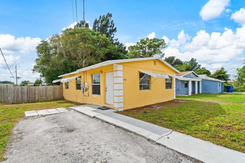 Discover the charm of this 3-bed, 1-bath home on a spacious - Beach Home for sale in Riviera Beach, Florida on Beachhouse.com