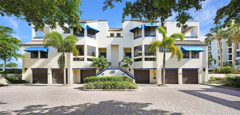 An extraordinary waterfront lifestyle awaits in this beautifully - Beach Townhome/Townhouse for sale in Longboat Key, Florida on Beachhouse.com