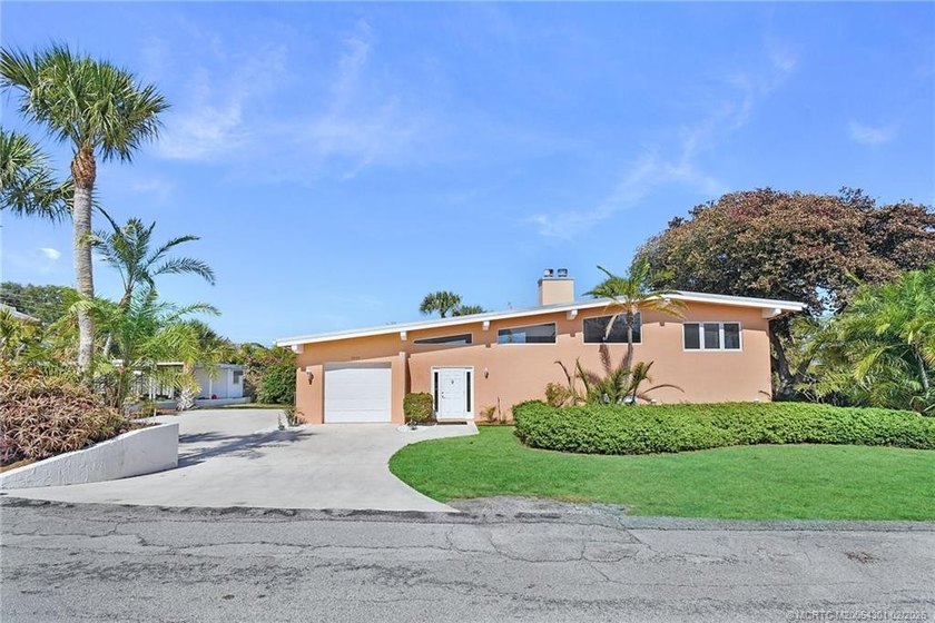 Experience striking architecture and true Florida living in this - Beach Home for sale in Jensen Beach, Florida on Beachhouse.com