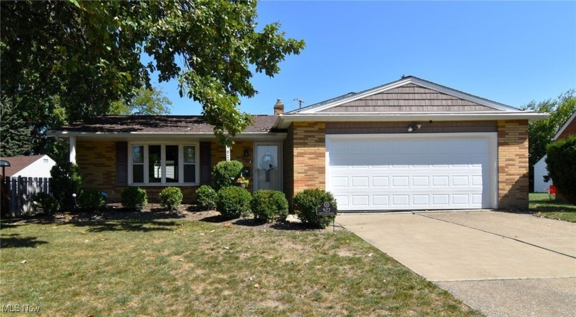 This lovingly maintained brick split-level home, complete with - Beach Home for sale in Euclid, Ohio on Beachhouse.com