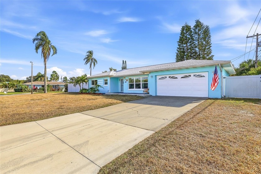 This Dunedin home offers three bedrooms, two bathrooms, and an - Beach Home for sale in Dunedin, Florida on Beachhouse.com