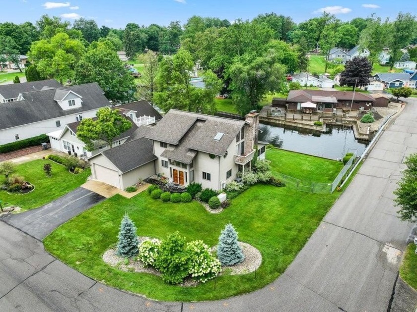 Discover the charm of this stunning waterfront home on Paw Paw - Beach Home for sale in Coloma, Michigan on Beachhouse.com