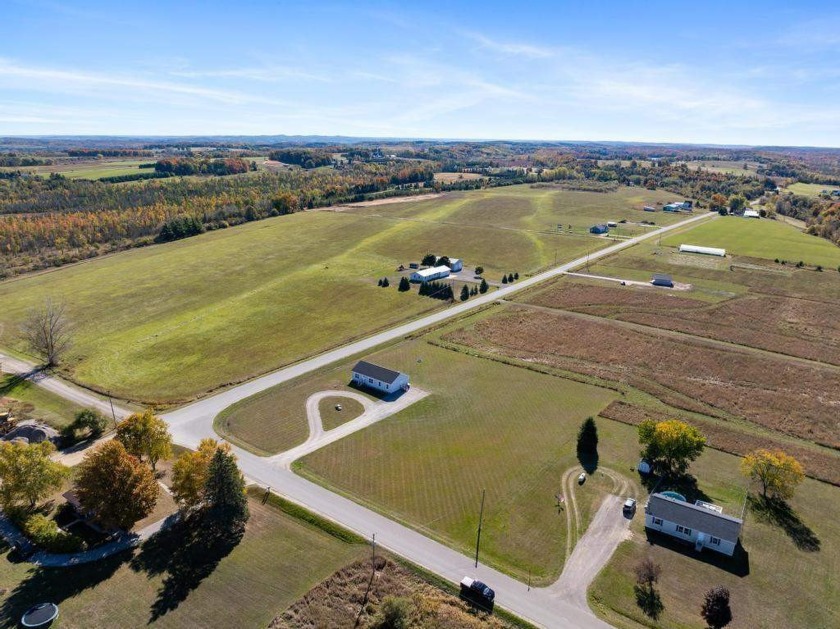 This charming 2021-built home on nearly 2 acres in Charlevoix is - Beach Home for sale in Charlevoix, Michigan on Beachhouse.com