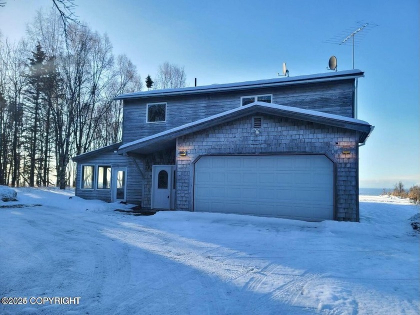 Priced to sell, this dream retreat, is perched along the serene - Beach Home for sale in Kenai, Alaska on Beachhouse.com