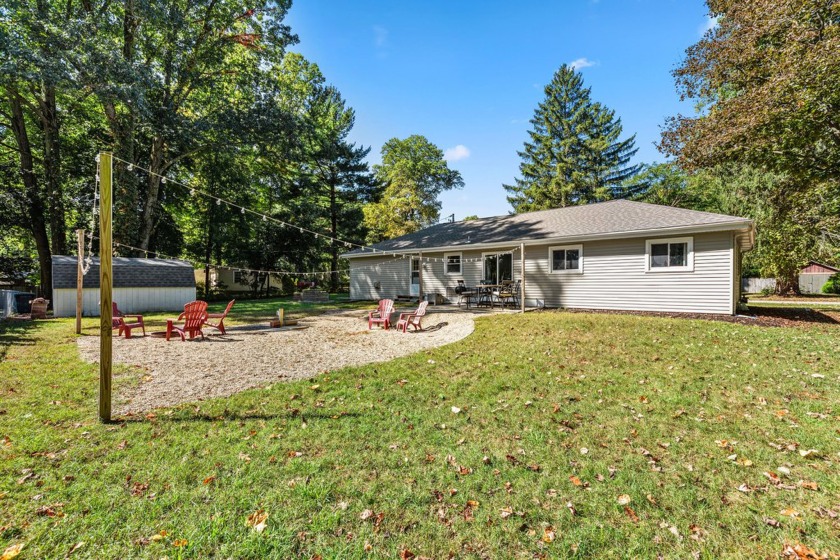 This charming and well-maintained home is set on a spacious - Beach Home for sale in Coloma, Michigan on Beachhouse.com