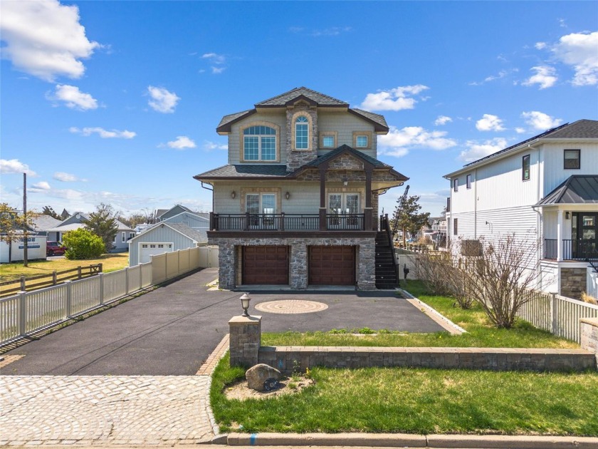 This magnificent Colonial-style residence, with a usable area of - Beach Home for sale in Amityville, New York on Beachhouse.com