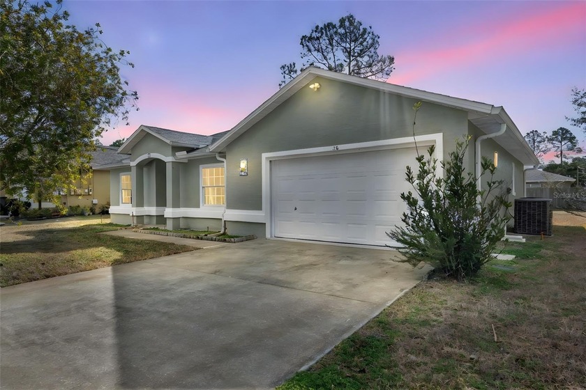 Welcome to this charming Palm Coast home! This 3-bedroom, 2-bath - Beach Home for sale in Palm Coast, Florida on Beachhouse.com