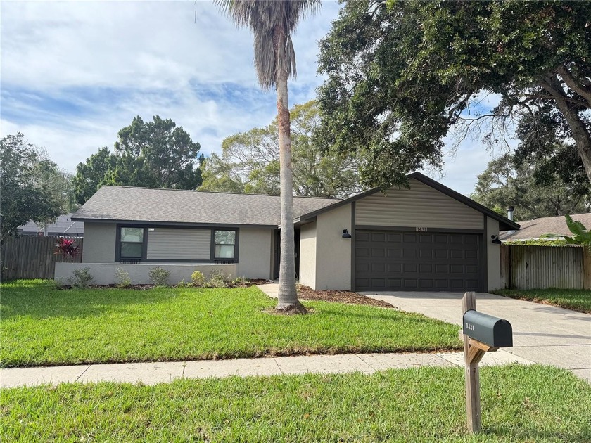 Fall in love with this move-in-ready three bedroom, two bath - Beach Home for sale in Palm Harbor, Florida on Beachhouse.com