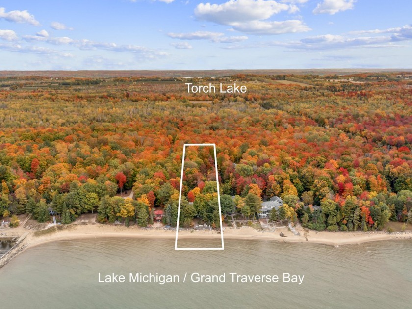 Experience breathtaking sunset views from your waterfront deck - Beach Home for sale in Kewadin, Michigan on Beachhouse.com