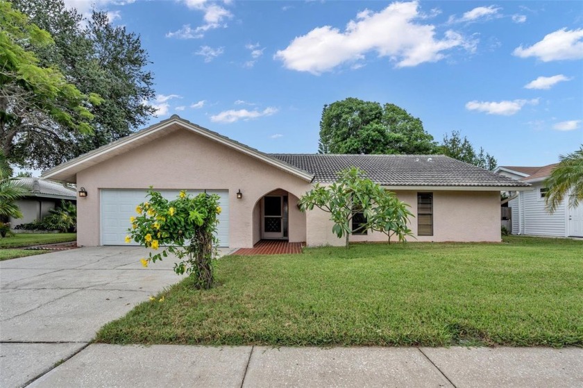 Nestled in the desirable Hillcrest Manor subdivision, this - Beach Home for sale in Largo, Florida on Beachhouse.com