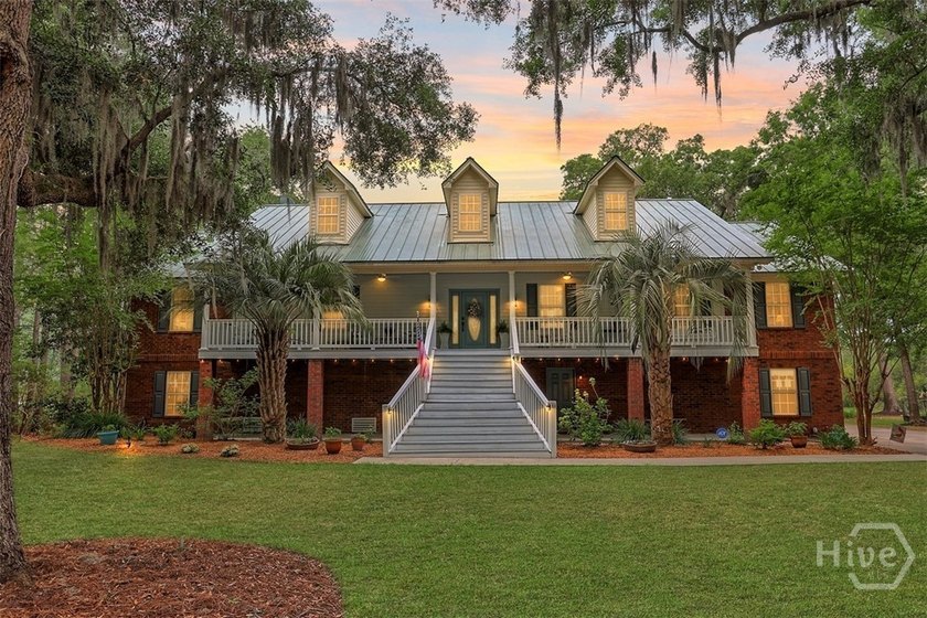 Gracefully set along sweeping marsh-front vistas, this - Beach Home for sale in Richmond Hill, Georgia on Beachhouse.com