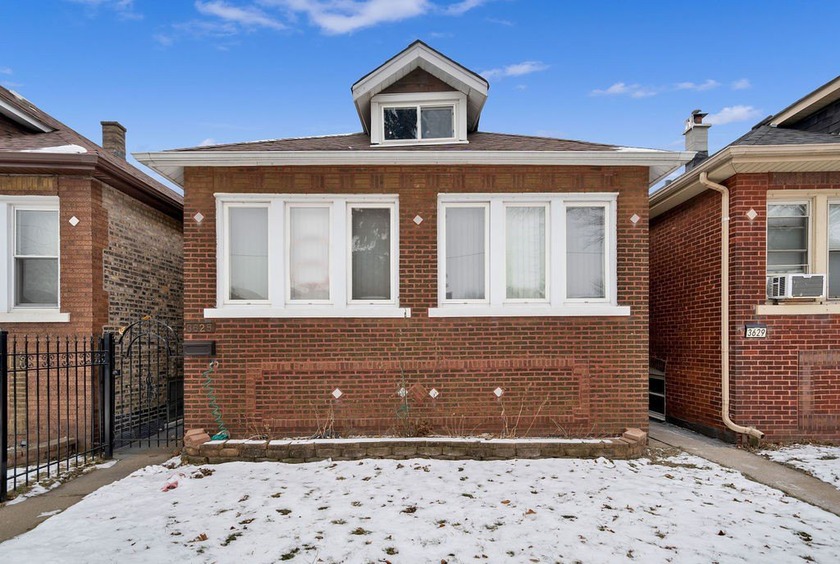 SOLID BRICK BUNGALOW IN WEST LAWN NEIGHBORHOOD! UPDATED KITCHEN - Beach Home for sale in Chicago, Illinois on Beachhouse.com