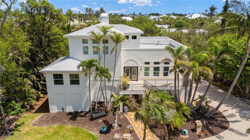 Tucked within the exclusive, gated community of Kinzie Island - Beach Home for sale in Sanibel, Florida on Beachhouse.com