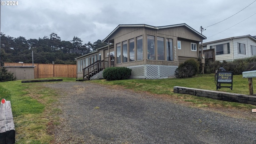 Stunning view of the beach and ocean from the roomy sunroom with - Beach Home for sale in Florence, Oregon on Beachhouse.com