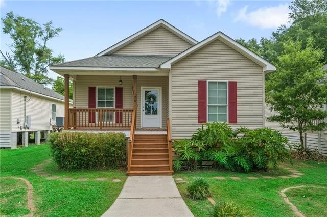 Charming raised cottage with a welcoming front porch, nestled on - Beach Home for sale in Slidell, Louisiana on Beachhouse.com