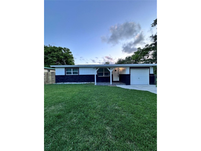 Discover this beautifully renovated single-family home, ideally - Beach Home for sale in Daytona Beach, Florida on Beachhouse.com