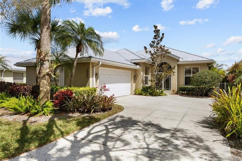 Discover this immaculate Divosta poured concrete Hampton model - Beach Home for sale in Palm City, Florida on Beachhouse.com