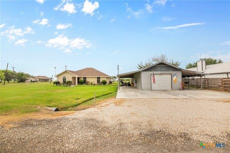 Sitting in a prime location, this 1524 sqft brick home is - Beach Home for sale in Austwell, Texas on Beachhouse.com