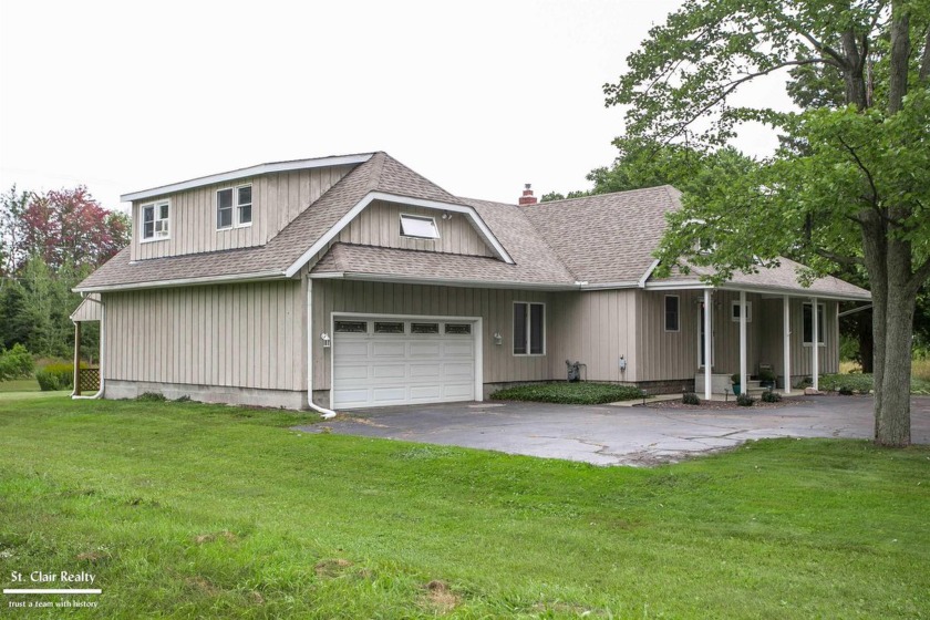 CHARMING SPACIOUS HOME ON BEAUTIFUL COUNTRY-LIKE SETTING!  This - Beach Home for sale in Fort Gratiot, Michigan on Beachhouse.com