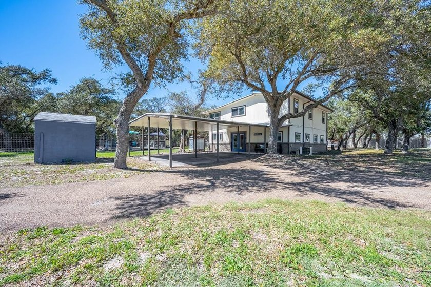 Set on 1.25 tree-filled acres just minutes from Rockport and - Beach Home for sale in Aransas Pass, Texas on Beachhouse.com
