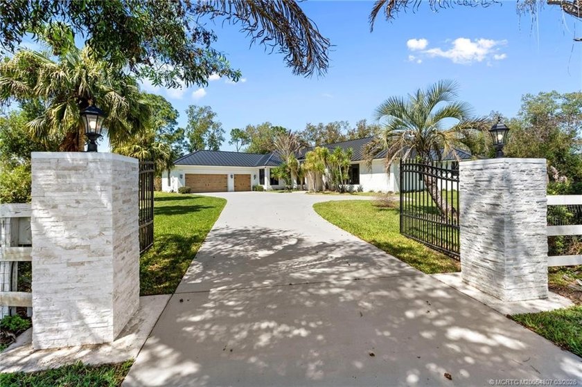 Welcome to your own private retreat - an extensively remodeled - Beach Home for sale in Palm City, Florida on Beachhouse.com