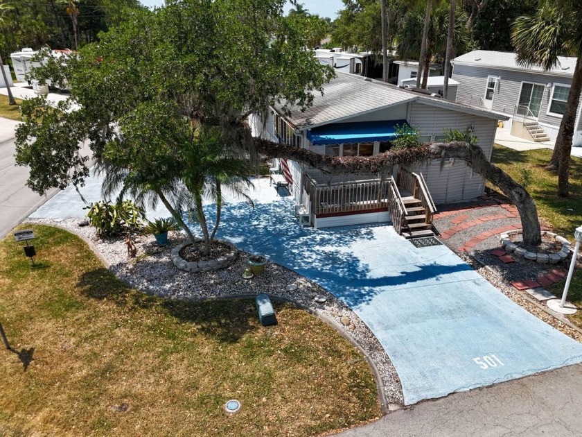 Located on a corner lot with ample room for guest parking, this - Beach Home for sale in Titusville, Florida on Beachhouse.com