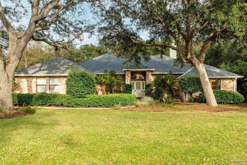 This remarkable, all brick, single owner home with a screened - Beach Home for sale in Navarre, Florida on Beachhouse.com