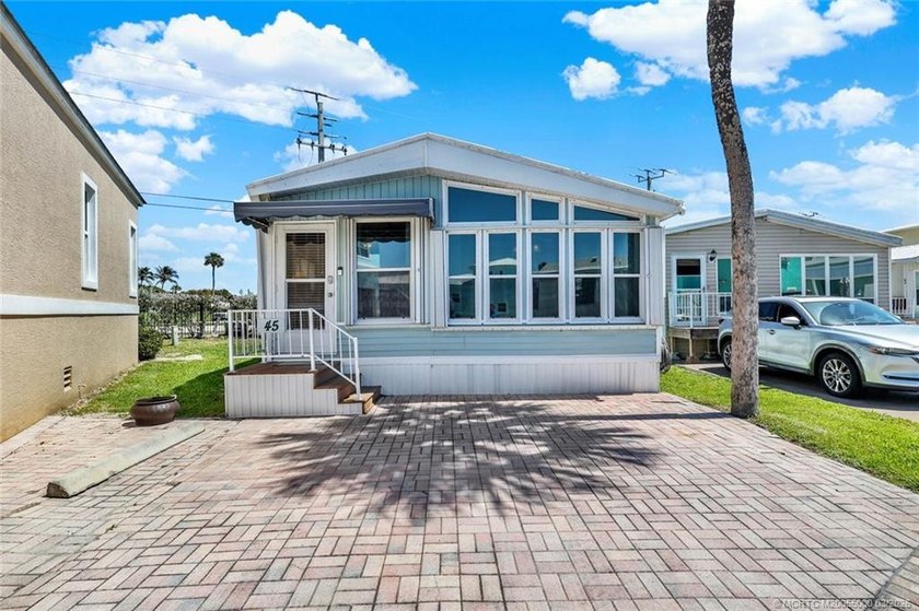 Set within Holiday Out, this home is next to the tunnel leading - Beach Home for sale in Jensen Beach, Florida on Beachhouse.com