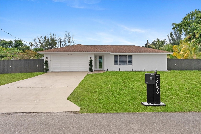 Come see this move-in ready 3-bedroom, 2-bath home situated on - Beach Home for sale in West Palm Beach, Florida on Beachhouse.com
