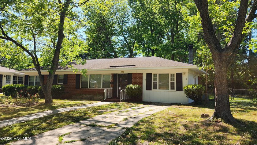 This updated brick ranch home is nestled in a great location - Beach Home for sale in Wilmington, North Carolina on Beachhouse.com