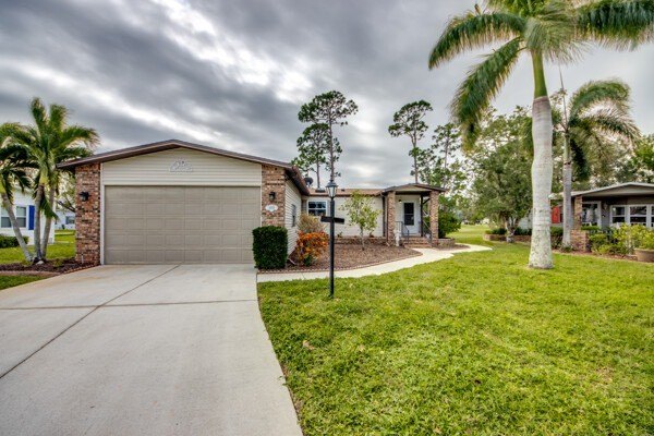 Discover the beauty of Pine Lakes Country Club with this - Beach Home for sale in North Fort Myers, Florida on Beachhouse.com