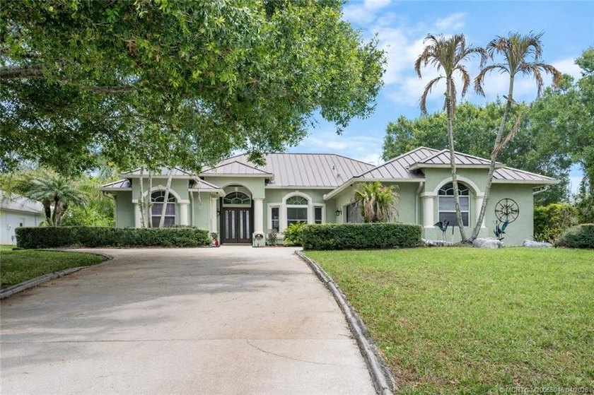 Beathtaking long lake views set the stage for this beautifully - Beach Home for sale in Palm City, Florida on Beachhouse.com