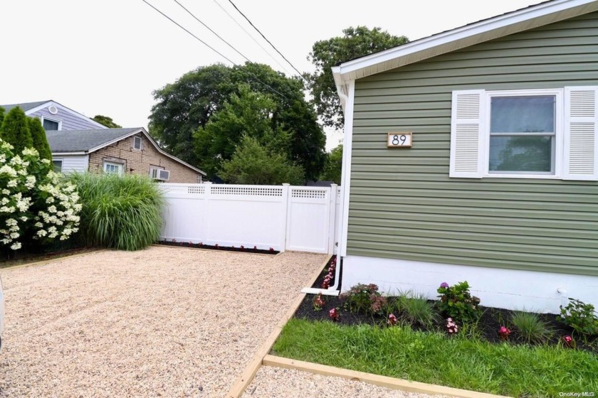 A beautifully renovated 3-bedroom, 2-bath ranch home that - Beach Home for sale in Mastic Beach, New York on Beachhouse.com