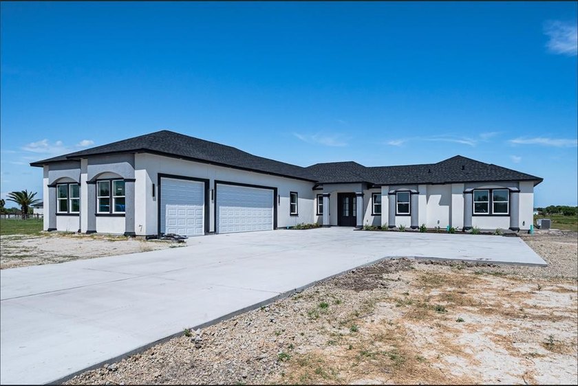New custom home on a quiet cul-de-sac across from Copano Bay! - Beach Home for sale in Rockport, Texas on Beachhouse.com