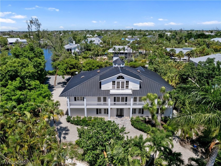 *This impeccably located Old Florida-style lake-front 3/4 - Beach Home for sale in Sanibel, Florida on Beachhouse.com