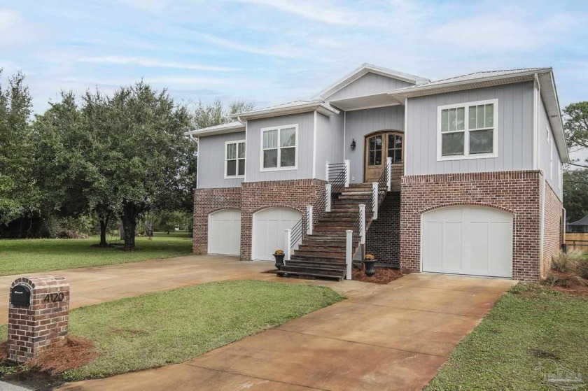 Welcome to your dream home nestled within Tiger Point! This - Beach Home for sale in Gulf Breeze, Florida on Beachhouse.com