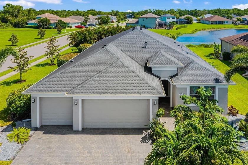 Premium private water views and an oversized corner lot set this - Beach Home for sale in Bradenton, Florida on Beachhouse.com