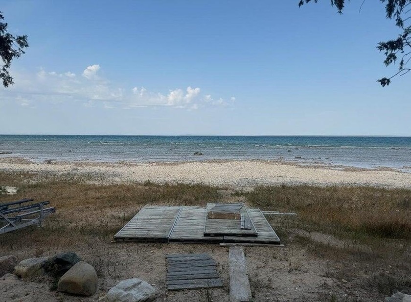 A unique opportunity to own 180 feet of frontage on Lake - Beach Lot for sale in Carp Lake, Michigan on Beachhouse.com