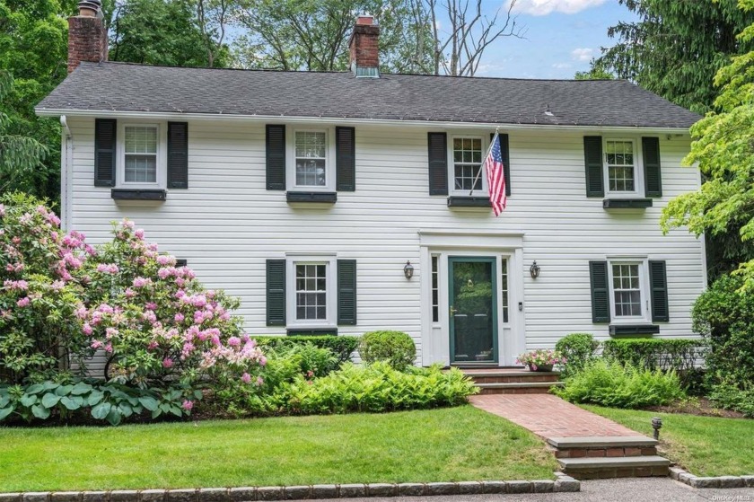 Situated on two flat park-like acres, this home looks out to a - Beach Home for sale in Laurel Hollow, New York on Beachhouse.com