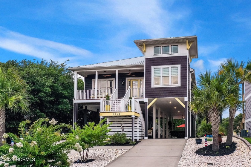 Experience the ultimate in outdoor entertaining with this - Beach Home for sale in Oak Island, North Carolina on Beachhouse.com